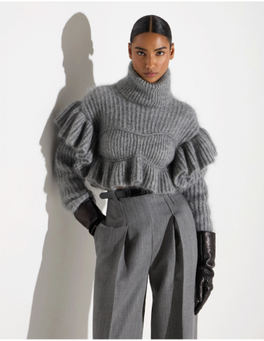 Women’s sweater with ruffles at the shoulders and waist